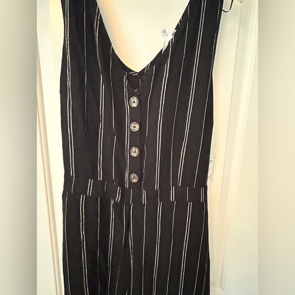 Black jumpsuit with white vertical stripes